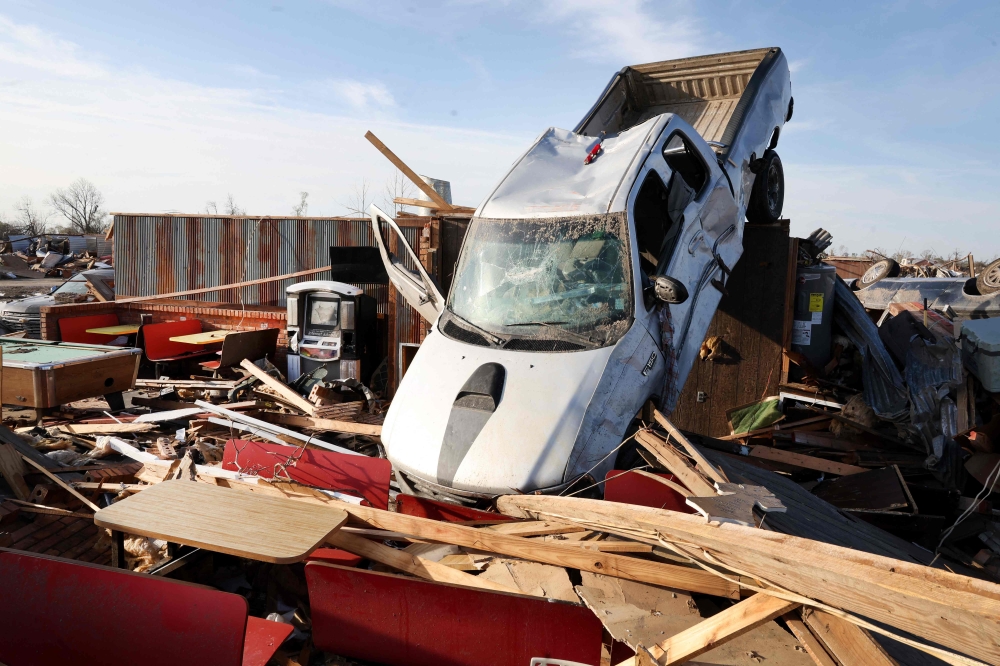 A truck rests inside the remains of a destroyed diner after it was hit Friday by an EF-4 tornado in Rolling Fork, Mississippi. — AFP pic