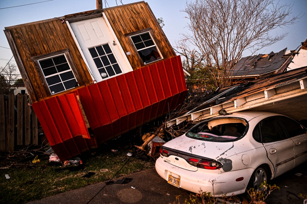 The remains of crushed house and cars are seen in Rolling Fork, Mississippi after a tornado touched down in the area. — AFP pic