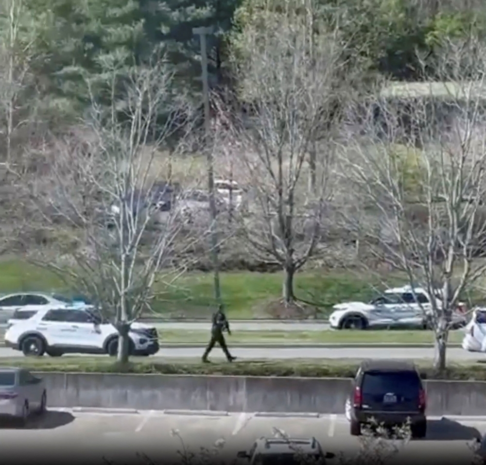 An armed officer walks after a mass shooting at the Covenant School, in Nashville, Tennessee March 27, 2023. ― TMX / Jozen Reodica/Handout via Reuters