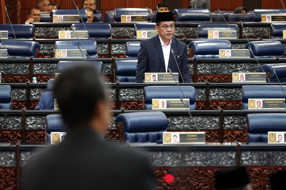 Minister in the Prime Minister’s Department (Religious Affairs) Datuk Mohd Na’im Mokhtar  speaks at the Parliament in Kuala Lumpur March 28, 2023. — Bernama pic