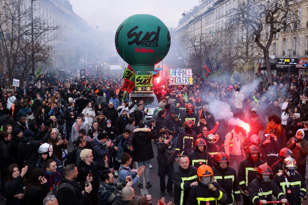 French firefighters and protesters on strike in Paris. — Reuters pic