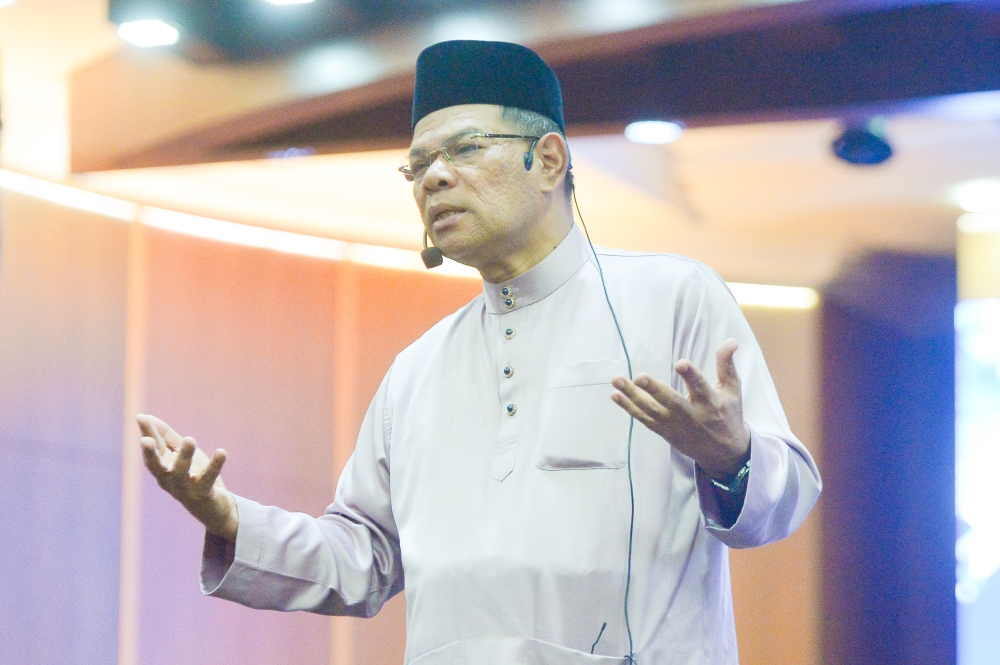Home Affairs Minister Datuk Seri Saifuddin Nasution speaks during a dialogue session with the media at the Ministry of Home Affairs in Putrajaya March 29, 2023. — Picture by Shafwan Zaidon
