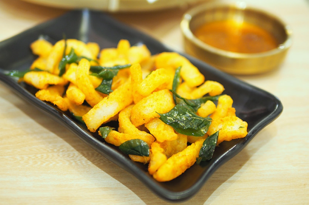 The unusual fried coconut has a mild taste of salted egg yolk