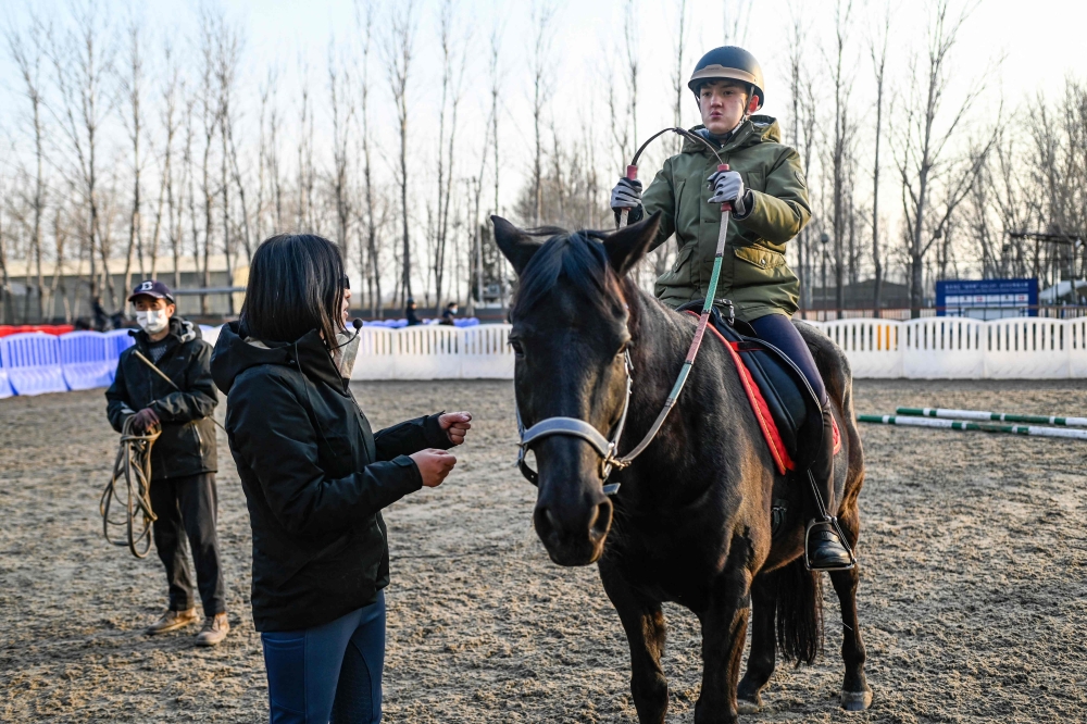 A charity in China is using horses to help young people with autism, building their confidence and coordination skills in a country where public understanding of the condition is limited.  — AFP pic