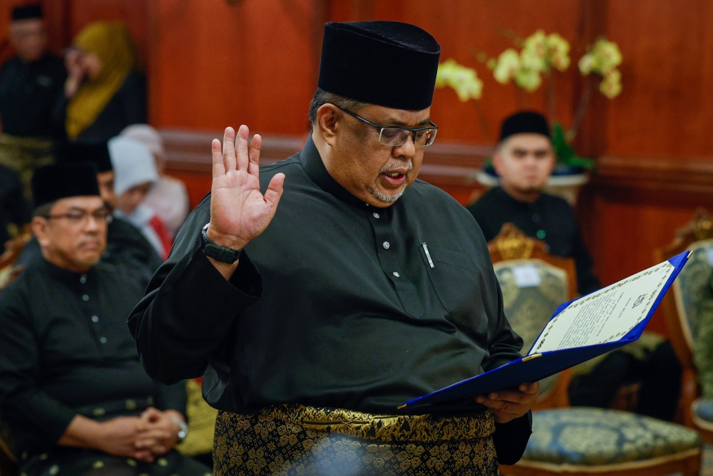 Tanjung Bidara assemblyman Datuk Seri Ab Rauf Yusoh takes oath of office as Melaka’s 13th Chief Minister at the swearing-in ceremony at Seri Negeri, Melaka March 31, 2023. — Bernama pic