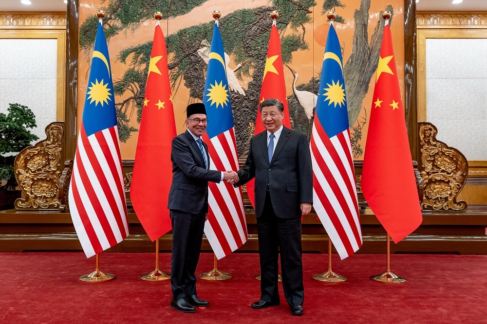 Prime Minister Datuk Seri Anwar Ibrahim and Chinese President Xi Jinping shake hands during their meeting in Beijing March 31, 2023. — Picture courtesy of Prime Minister’s Office of Malaysia/Sadiq Asyraf 