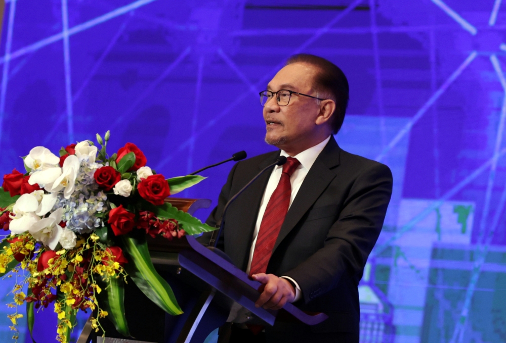Prime Minister Datuk Seri Anwar Ibrahim delivers a keynote address at the Malaysia-China Business Forum 2023 in Beijing April 1, 2023. — Bernama pic