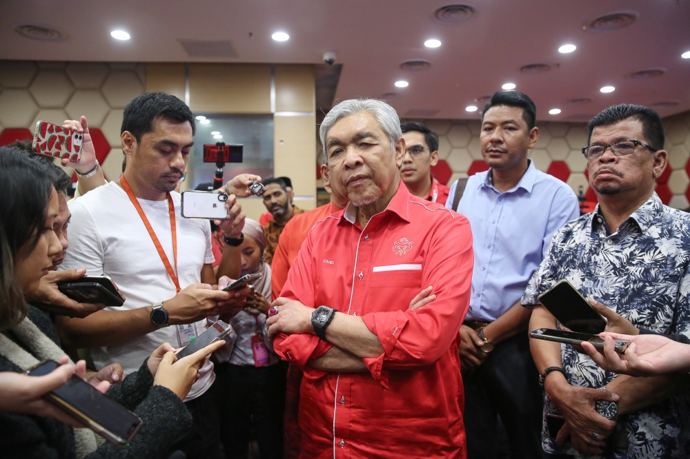 Umno president Datuk Seri Ahmad Zahid Hamidi speaks to reporters during the 2023-2026 Umno election results at the party's headquarters in Kuala Lumpur March 18, 2023. — Picture by Yusof Mat Isa