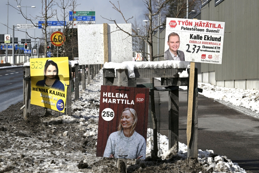 Election posters of the Finns and SDP are seen in Espoo, Finland, March 29, 2023. — Reuters pic