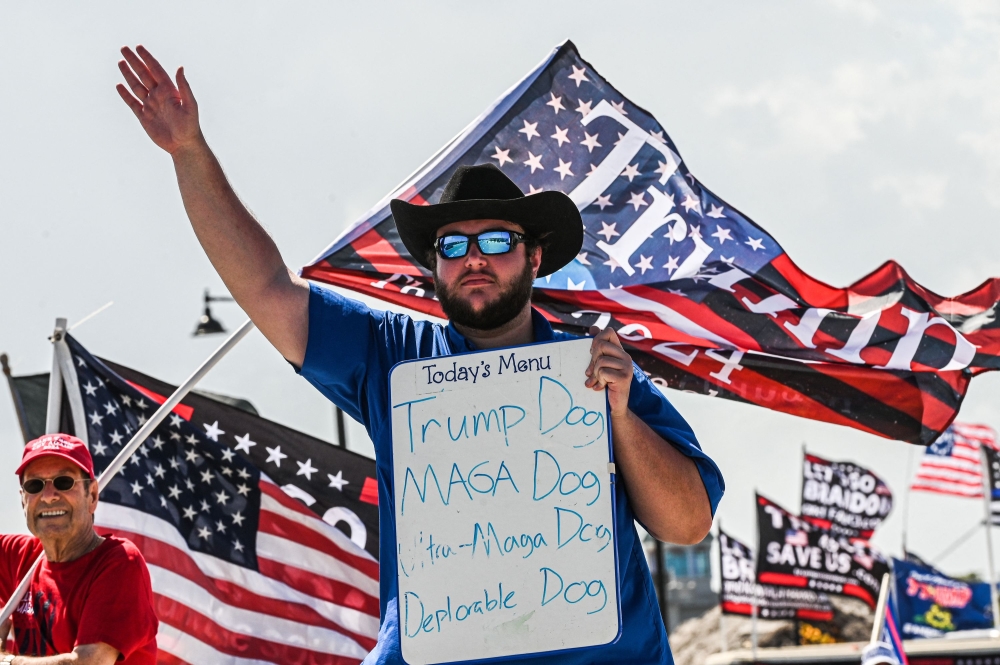 Supporters of former US President Donald Trump gather near Mar-a-Lago in Palm Beach, Florida, on April 2, 2023. — AFP pic