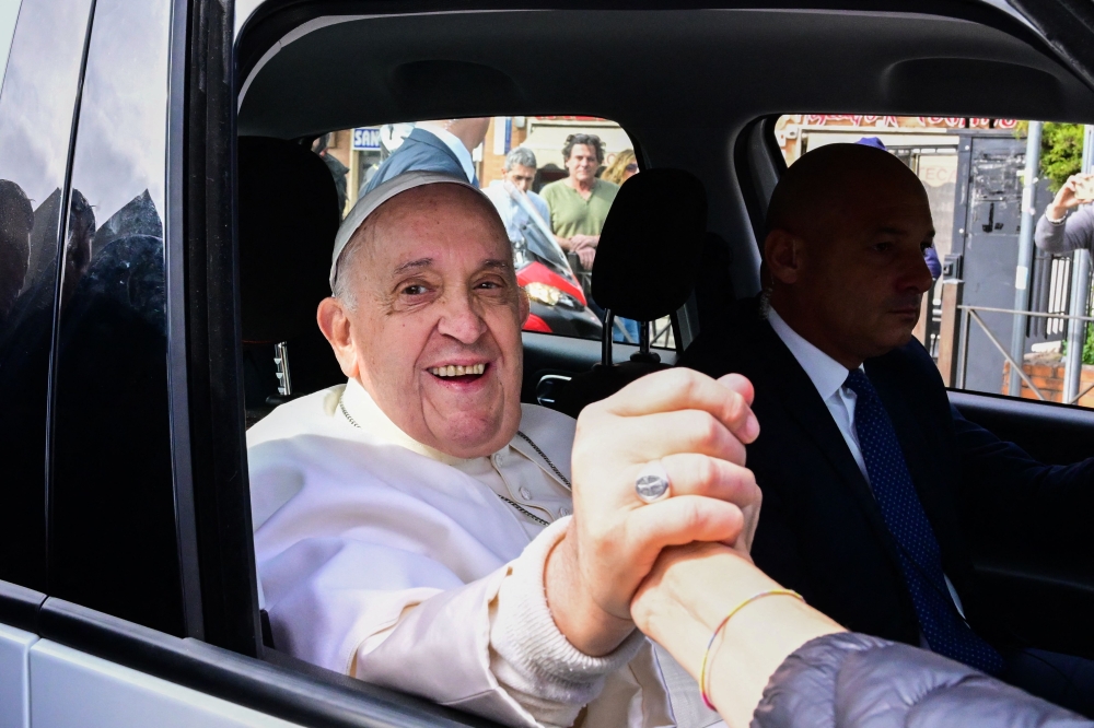 Pope Francis leaves the Gemelli hospital on April 1, 2023 in Rome, after being discharged following treatment for bronchitis. — AFP pic
