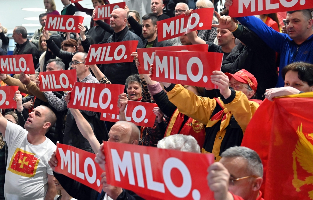 Supporters cheer for incumbent president of Montenegro during the final pre-election rally before the second round of the presidential elections at ‘Moraca’ sports hall in Podgorica, on March 31, 2023. — AFP pic