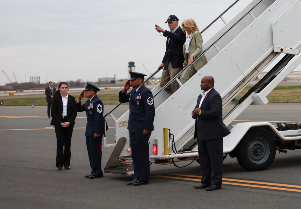 US President Joe Biden and First Lady Jill Biden disembark from Air Force One as they arrive at Philadelphia international airport in Philadelphia, Pennsylvania March 31, 2023. — Reuters pic