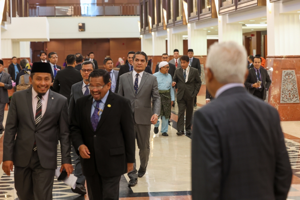Opposition MPs stage a walkout at the Parliament in Kuala Lumpur April 3, 2023. — Bernama pic