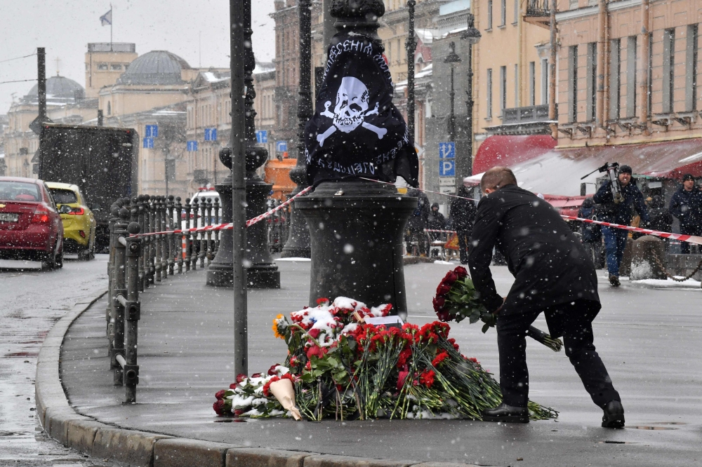 Flowers at a makeshift memorial by the explosion site in Saint Petersburg for Russian military blogger Vladlen Tatarsky, whose real name is Maxim Fomin, killed in a bomb blast. — AFP pic