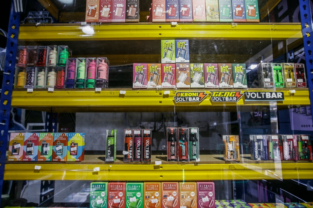 Products are seen on the shelves of a vape store March 30, 2023. — Picture by Hari Anggara