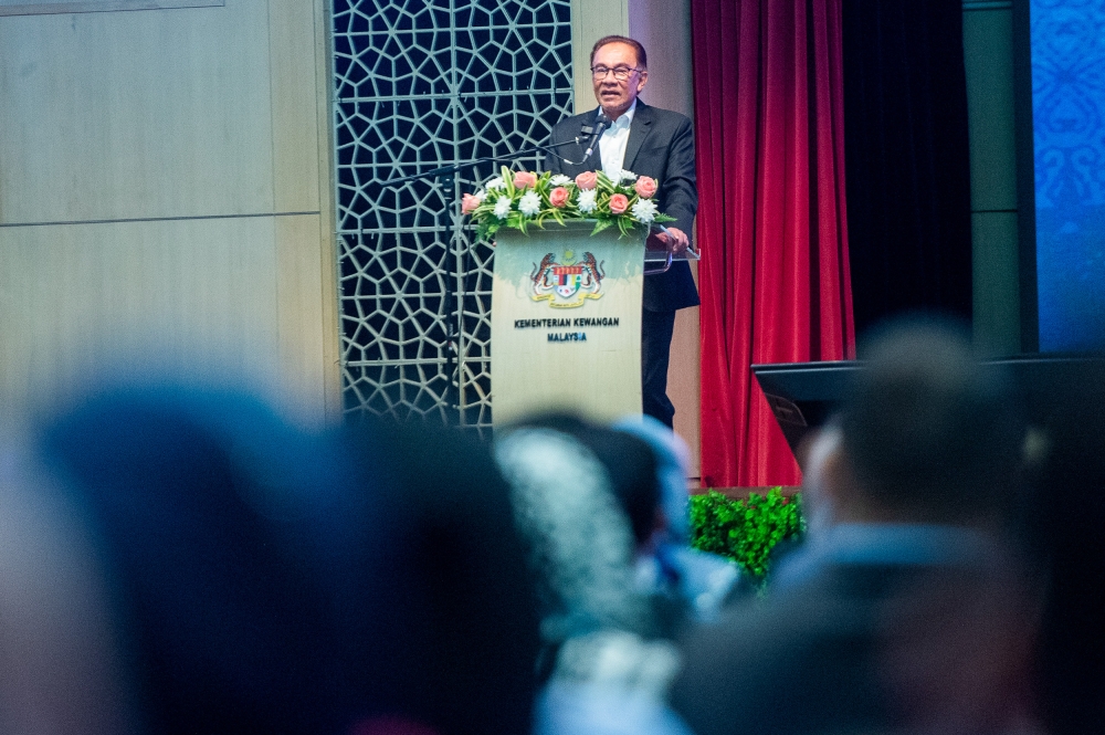 Prime Minister Datuk Seri Anwar Ibrahim delivers his speech at the Finance Ministry’s monthly staff assembly in Putrajaya April 4, 2023. — Picture by Shafwan Zaidon
