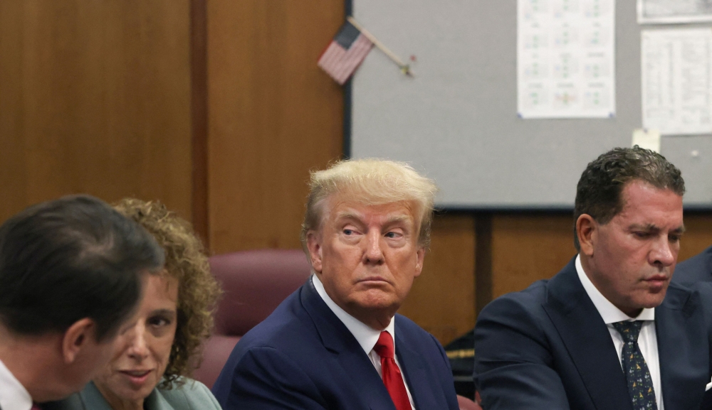 Former US president Donald Trump appears in court at the Manhattan Criminal Court in New York on April 4, 2023. — AFP pic