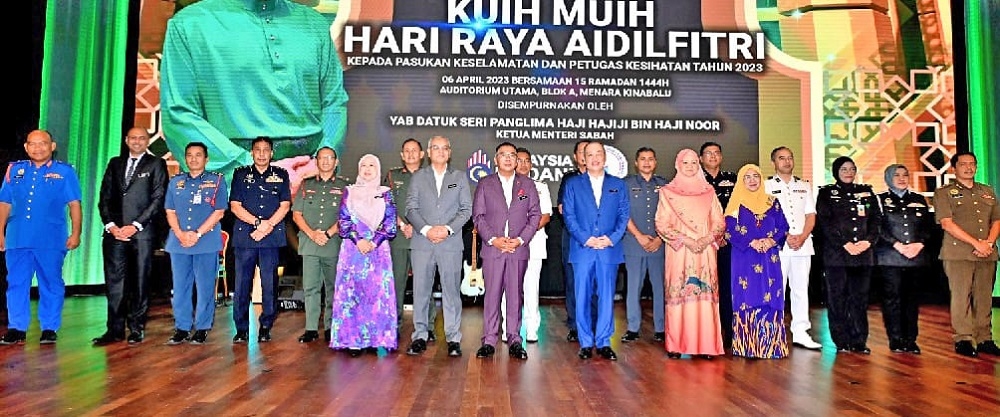 Sabah Chief Minister Datuk Seri Hajiji Noor (front, 3rd right) poses with the security forces and health officers at the event in Kota Kinabalu April 6, 2023. — Borneo Post pic
