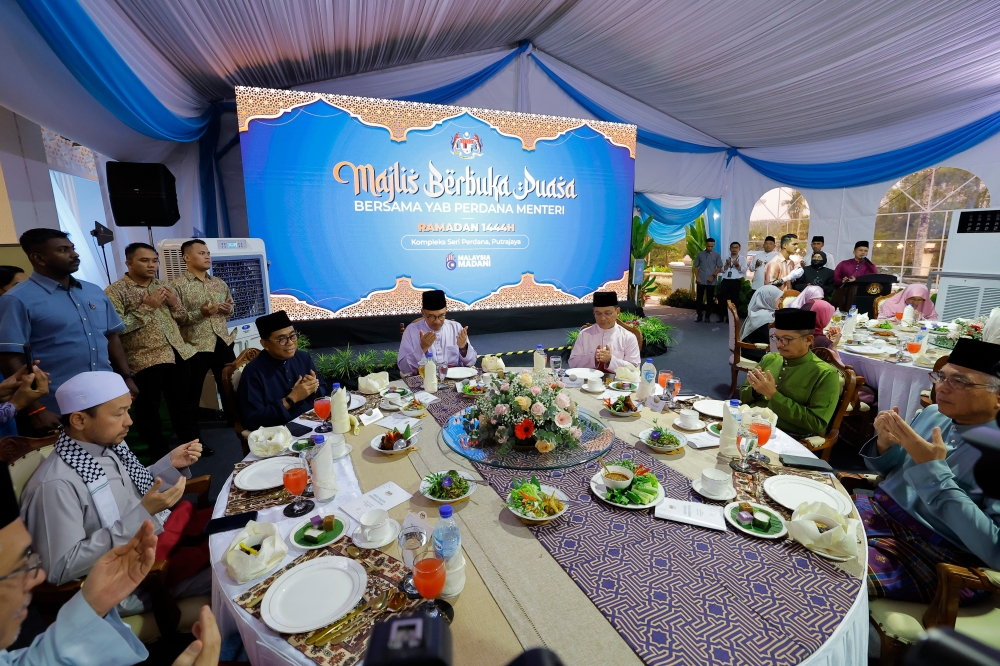 Prime Minister Datuk Seri Anwar Ibrahim breaks fast with academics, scholars, ulama and Islamic NGOs in Seri Perdana, Putrajaya April 6, 2023. — Bernama pic