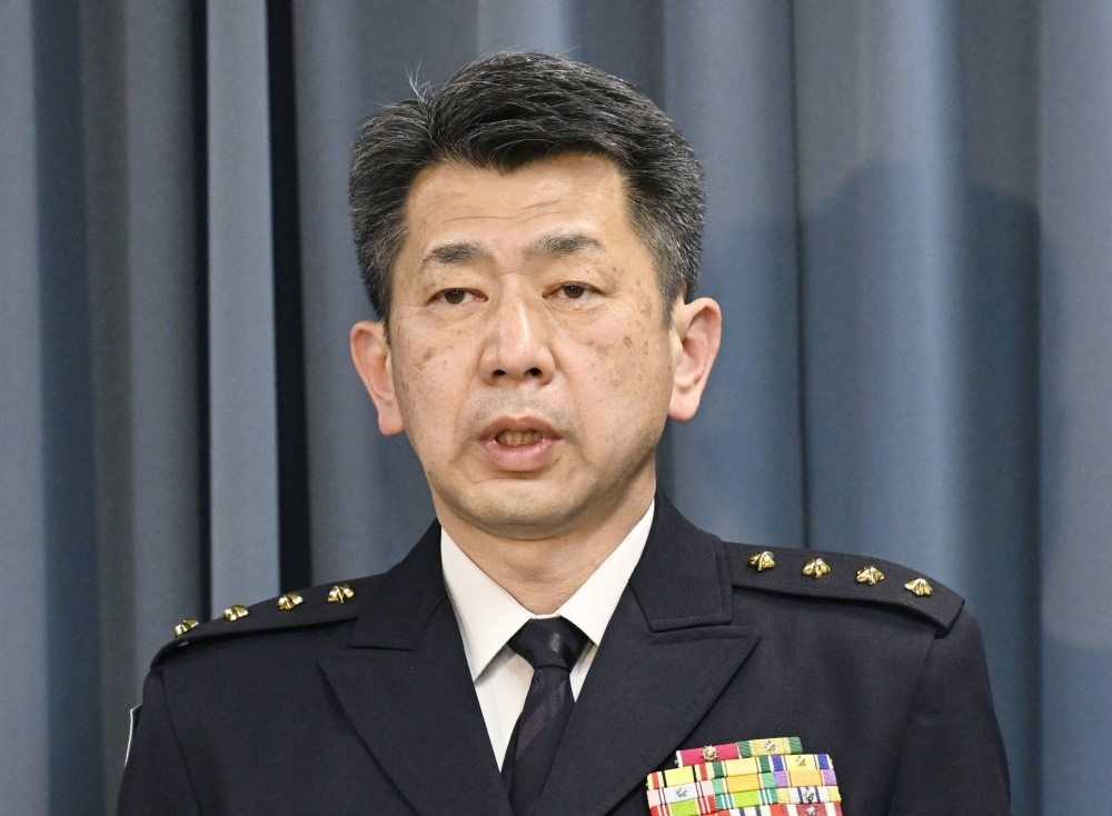 General Yasunori Morishita, head of the Japanese Ground Self-Defence Force, holds a news conference after reports that a military helicopter crashed in the sea near Miyakojima. — Reuters pic/Kyodo