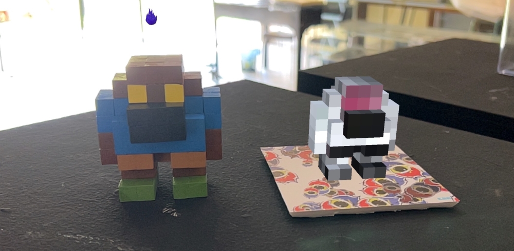 Posi. by Kangblabla with the accompanying AR piece, Nega (right), are displayed at the Hin Bus Depot in George Town. — Picture by Opalyn Mok