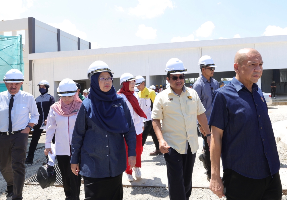 Health Minister Dr Zaliha Mustafa (3rd left) makes a working visit to the project site of the Papar Hospital in Papar April 8, 2023. — Bernama pic