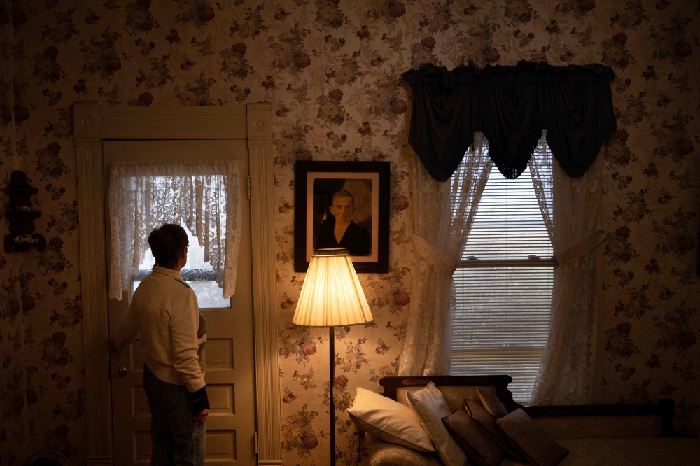 Susan Burns looks out the front of her home, which has been in the family since 1890, towards land that has been leased for solar energy production in Hereford, Missouri March 16, 2023. — AFP pic