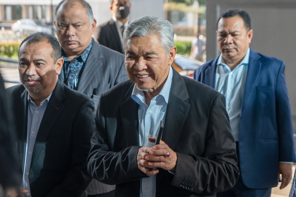 Deputy Prime Minister Datuk Seri Ahmad Zahid Hamidi (centre) arrives at the Kuala Lumpur Court Complex April 10, 2023. — Picture by Shafwan Zaidon