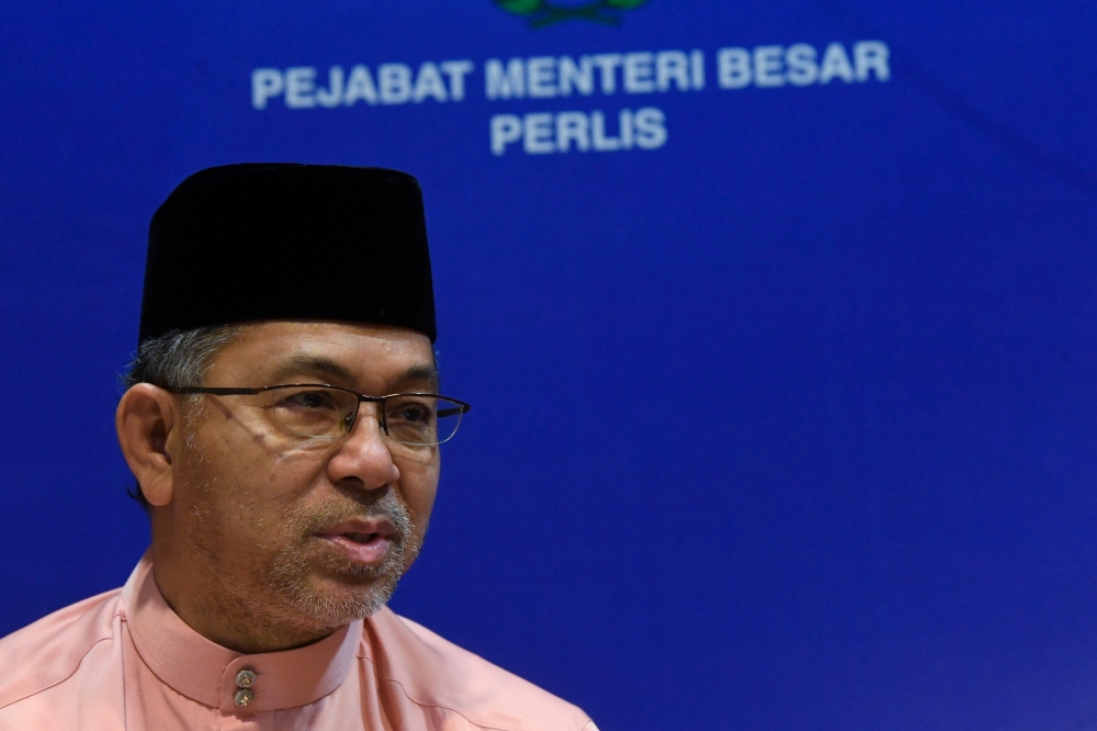 Ex-Perlis MB Azlan Man pleads not guilty to charges of submitting false ...