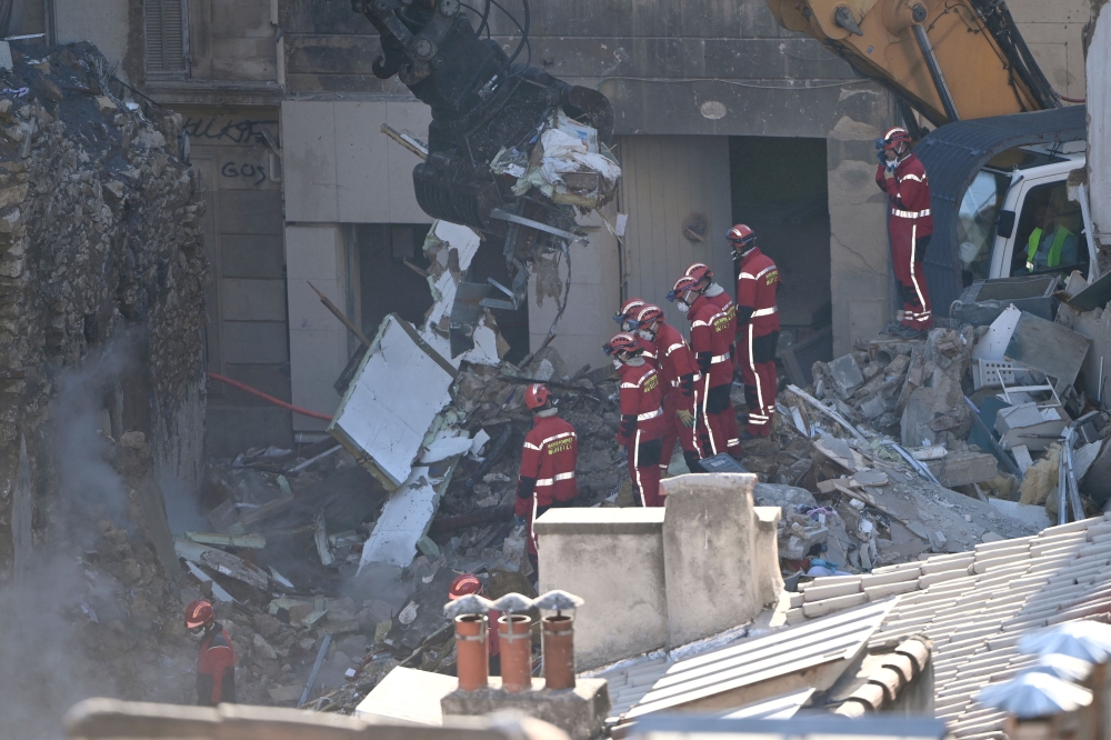 French rescue workers recover four bodies from collapsed Marseille ...