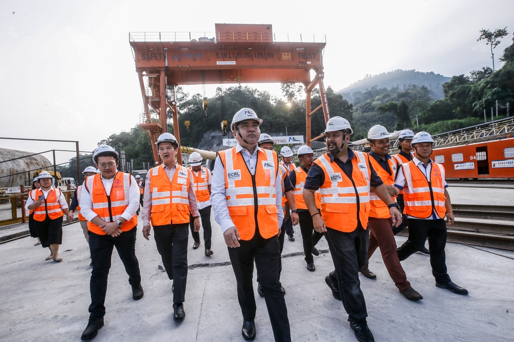 Transport Minister Anthony Loke (centre) is seen during a working visit to the Genting ECRL tunnel construction site in Bentong April 11, 2023. — Picture by Hari Anggara