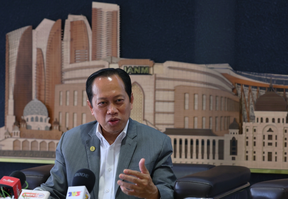 Deputy Finance Minister Datuk Seri Ahmad Maslan speaks during a press conference at the Accountant-General’s Department in Putrajaya April 12, 2023. — Bernama pic