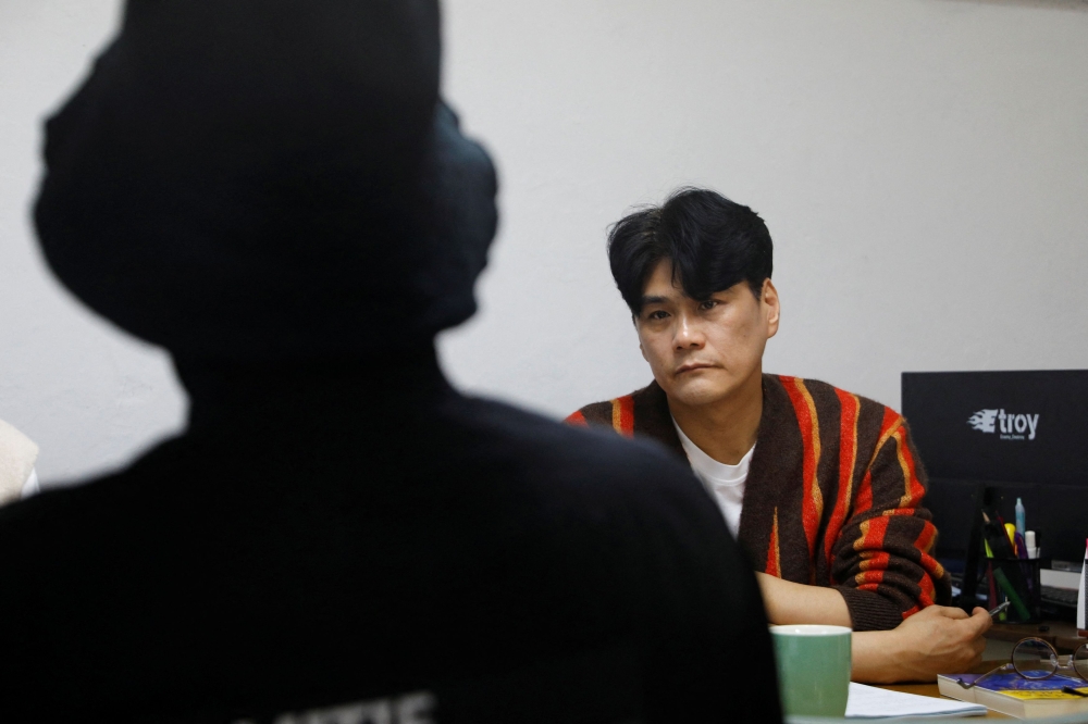 Choi Jin-mook, 48, Chief Director of Drug Addiction Rehabilitation Centre (DARC) and visiting professor of Department of Addiction Rehabilitation and Social Welfare at Eulji University, listens to a recovering drug addict during a group counselling for drug addicts in Incheon, South Korea, April 1, 2023. — Reuters pic
