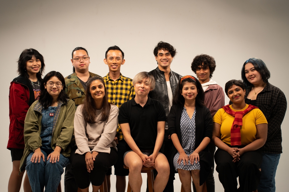 Theatresauce artistic director Kelvin Wong (centre, seated) and the ensemble and creative team for ‘Come Home and Eat’. — Picture by Siaw Boon Keat