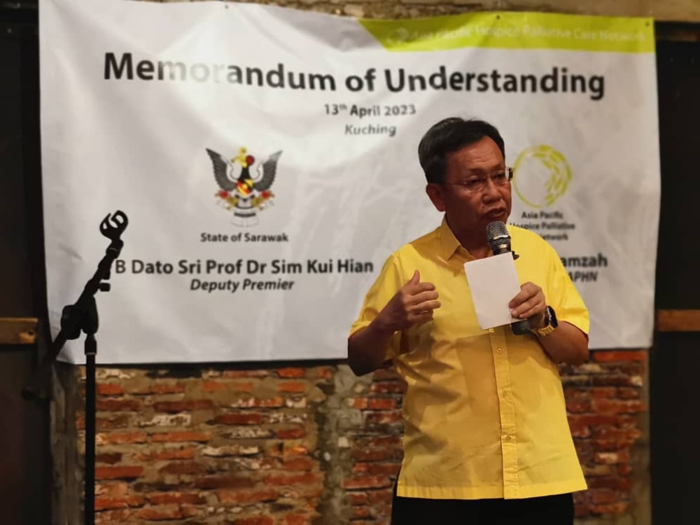 Dr Sim delivers his welcoming remarks prior to the MoU signing. ― Borneo Post pic