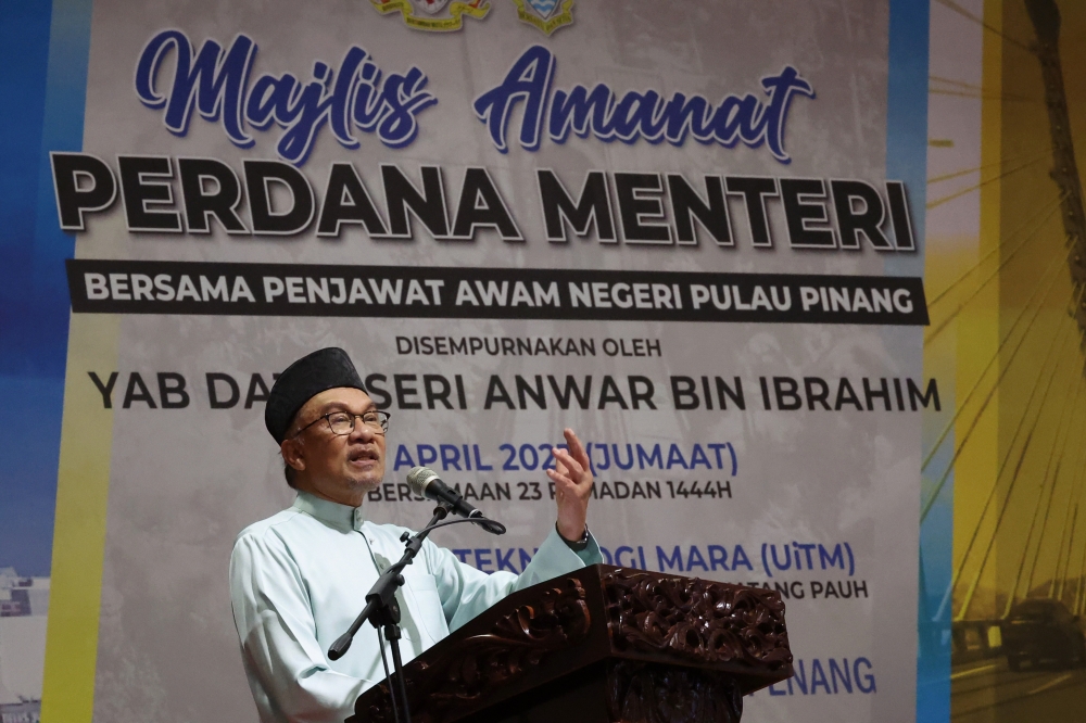 Prime Minister Datuk Seri Anwar Ibrahim delivers a speech during a meeting with civil servants at Universiti Teknologi Mara (UiTM) Permatang Pauh in Penang April 14, 2023. — Bernama pic