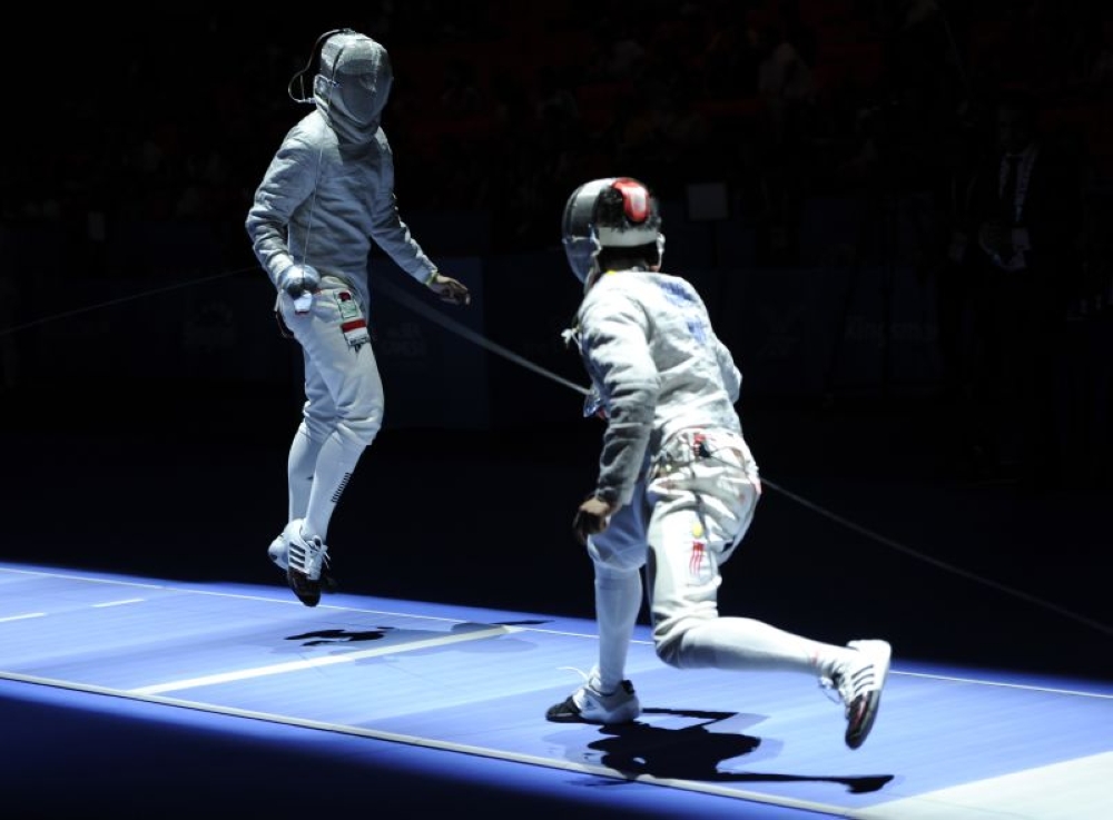 Indonesia’s Ricky Dhisullimah (left) with Malaysia’s Wong Tzer Chyuan in the Men’s Individual Sabre Pool fencing event at the 28th SEA Games Singapore 2015 in this file picture taken on May 2, 2015. — Reuters pic 