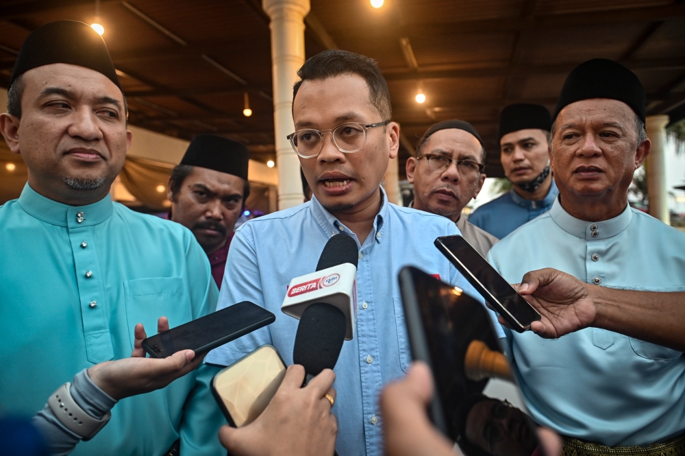 Minister of Natural Resources, Environment and Climate Change Nik Nazmi Nik Ahmad meeting reporters at the Ramadan Iftar at Batu Buruk Beach Resort in Kuala Terengganu, April 14, 2023. — Bernama pic