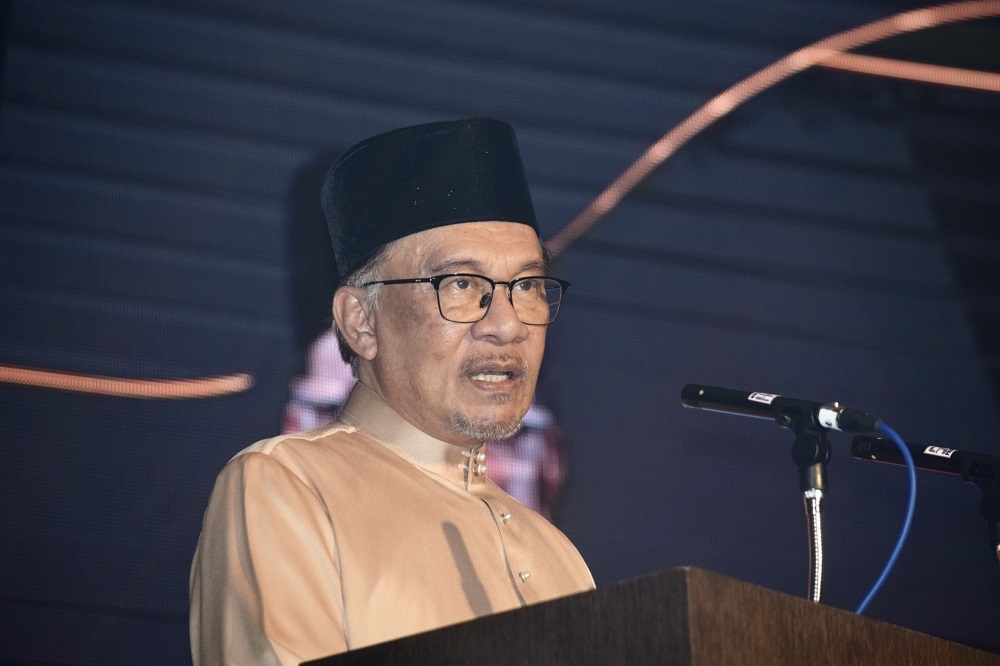 Prime Minister Datuk Seri Anwar Ibrahim delivers his speech during the official opening of the Raia Hotel and Convention Centre Kuching, in Kuching April 17, 2023. — Borneo Post Online pic