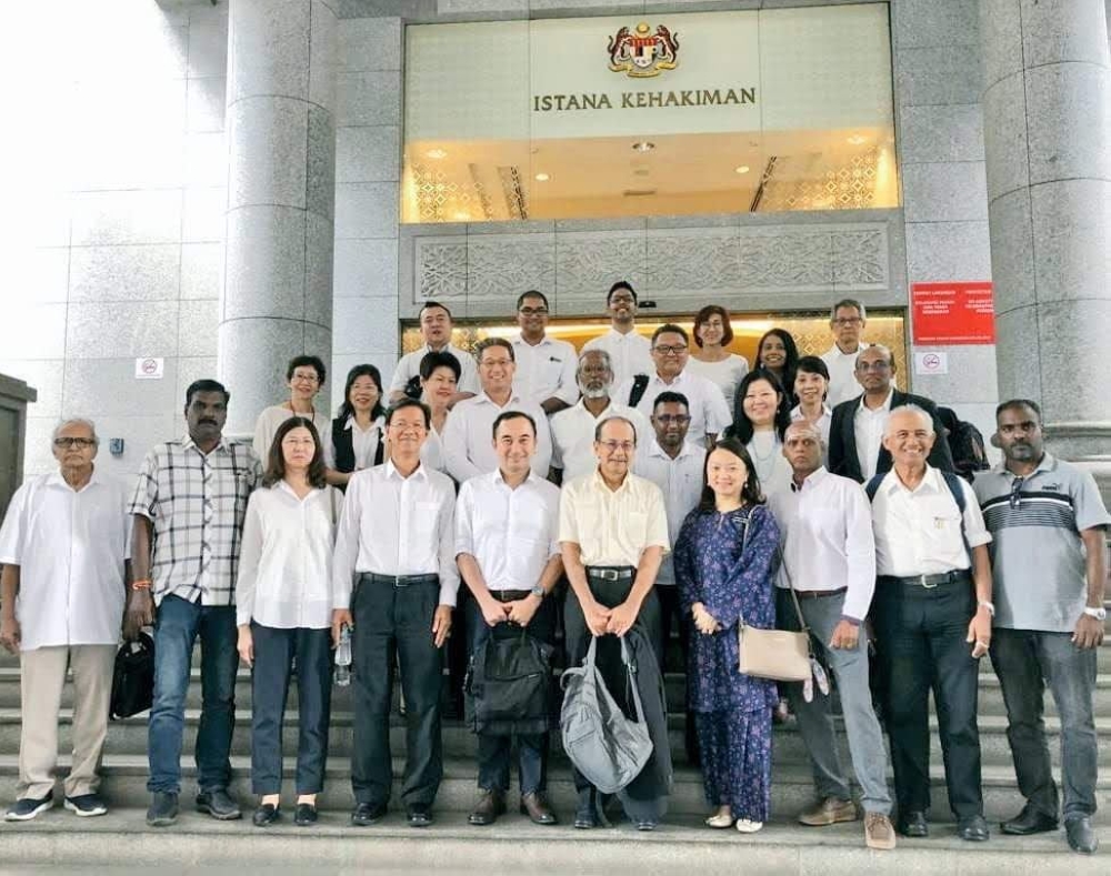 Segambut MP Hannah Yeoh (bottom row, fourth from right) described the Federal Court’s decision in dismissing an appeal by the developer to reinstate the proposed Taman Rimba Kiara development project as a triumphant battle against those with deep pockets. — Picture via Twitter/Hannah Yeoh