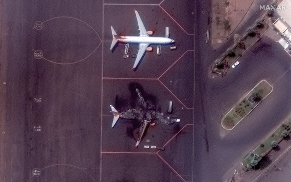 Satellite image shows a destroyed airplane at Khartoum International Airport in this handout image. — Reuters pic/Maxar Technologies