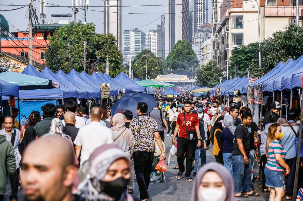 People visit the Ramadan bazaar in Jalan Raja Alang Kampung Baru April 12, 2023. ― Picture by Hari Anggara