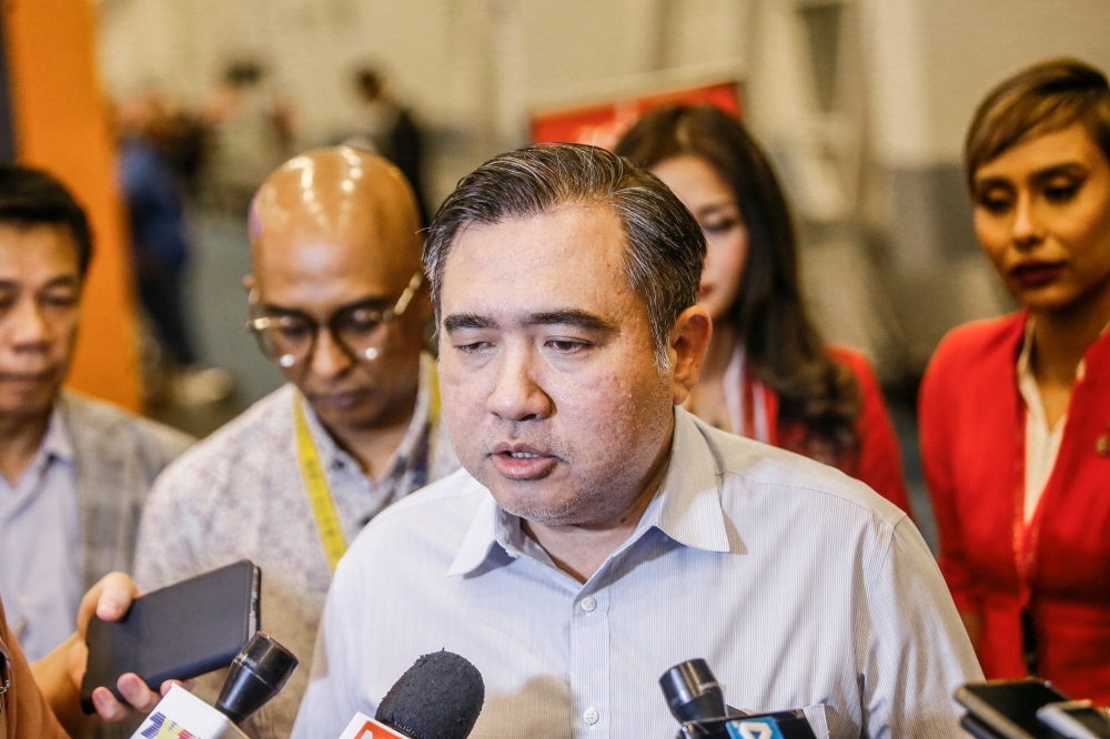 Transport Minister Anthony Loke speaks to reporters at Kuala Lumpur International Airport Terminal 2, April 20, 2023. ― Picture by Hari Anggara