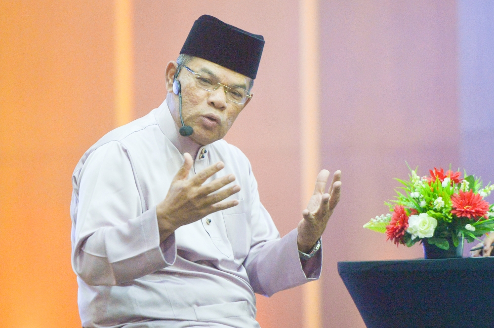 Home Minister Datuk Seri Saifuddin Nasution Ismail said the ministry workforce is committed to working harder for the country and the people. — Picture by Shafwan Zaidon