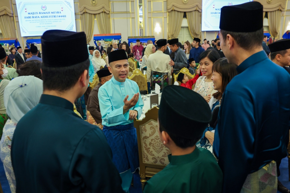 Communications and Digital Minister Fahmi Fadzil, who is also Pakatan Harapan communications director, speaks to visitors at the Hari Raya Aidilfitri reception at Istana Negara, Kuala Lumpur April 22, 2023. — Bernama pic