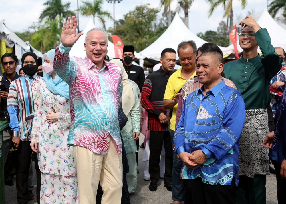 Sultan of Perak Sultan Nazrin Shah waving to the crowd at the Perak State Aidilfitri Celebration at the Indera Mulia Stadium grounds in Ipoh, April 22, 2023. — Bernama pic