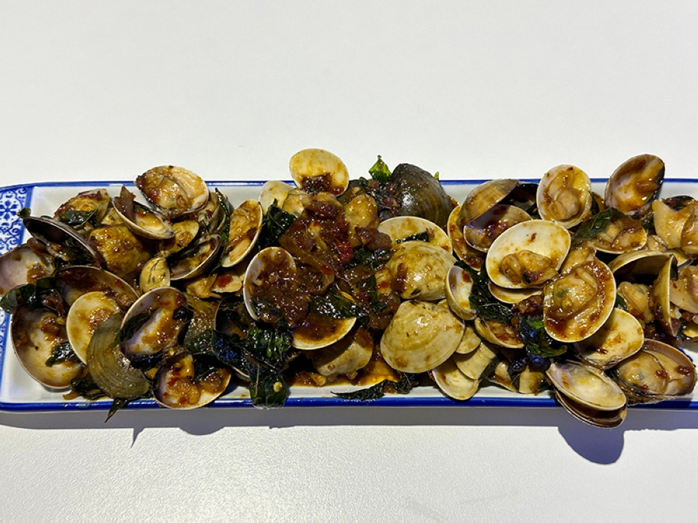 One of the side dishes include 'kam heong' or a deeply fragrant sauce which is stir fried with clams.