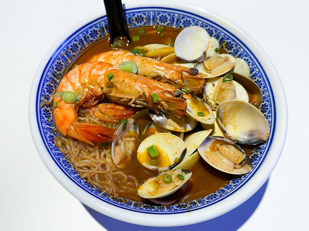 Tomyum Lala noodles with tiger prawns packs a spicy punch perfect for rainy nights.