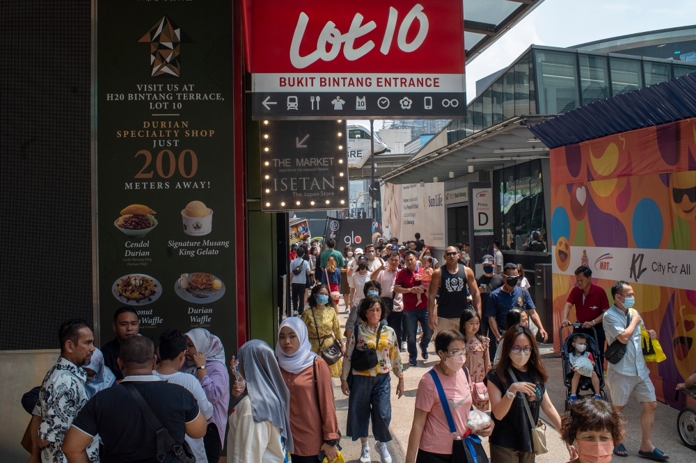 People wandering around Bukit Bintang in Kuala Lumpur during the public holiday in conjunction with AHari Raya Aidilfitri April 24, 2023. — Picture by Shafwan Zaidon
